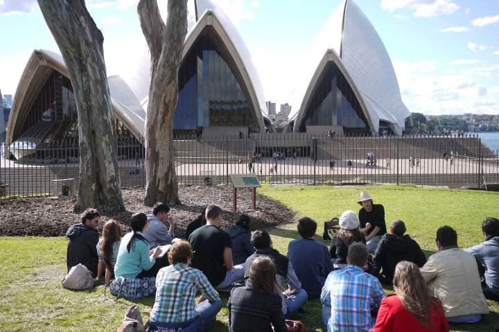 a group of people sitting at a park